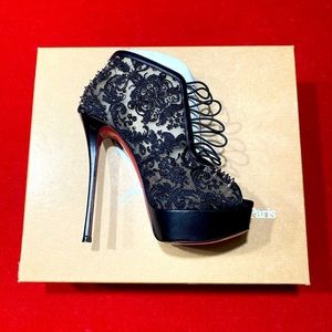 Christian Louboutin black lace with spikes 6in stiletto heels.